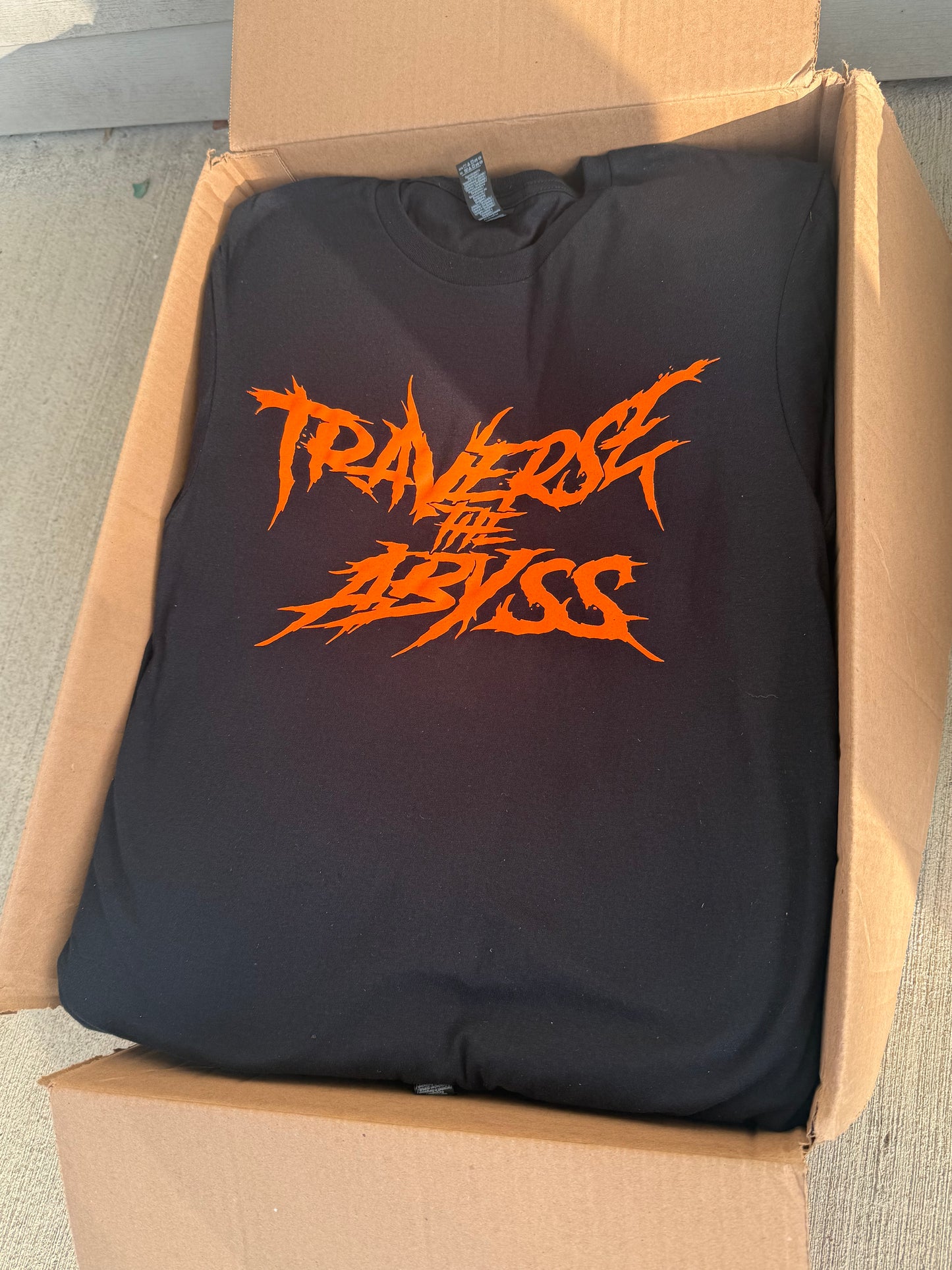 Traverse the Abyss Orange Logo Shirt
